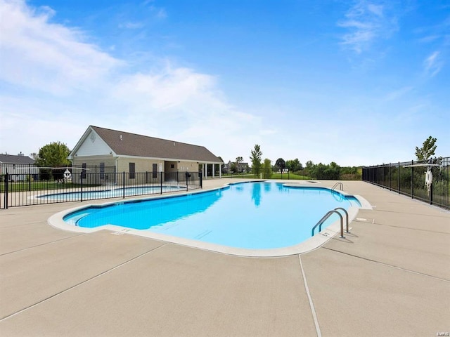 view of pool featuring a patio