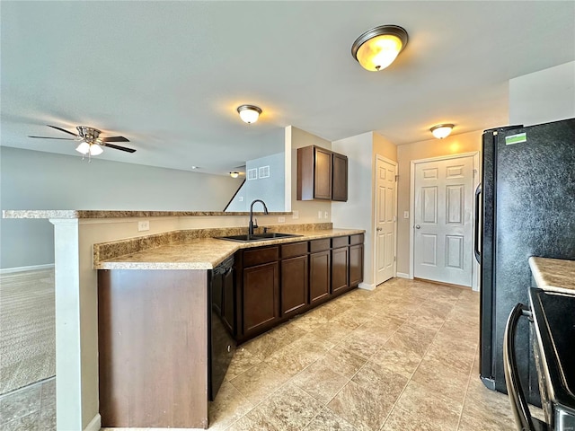 kitchen featuring black appliances, sink, ceiling fan, dark brown cabinets, and kitchen peninsula