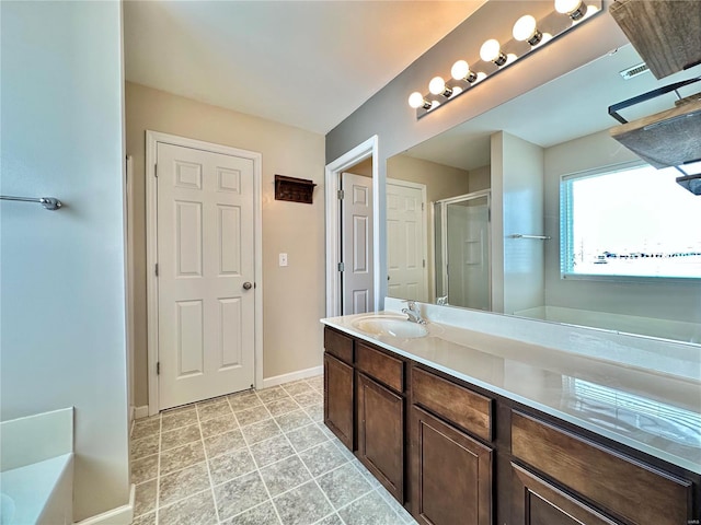 bathroom with shower with separate bathtub and vanity