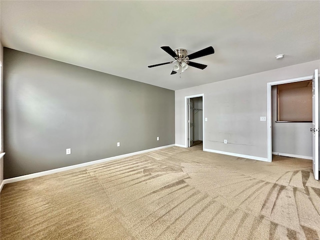 empty room with light carpet and ceiling fan