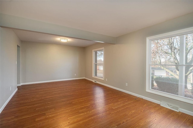 unfurnished room featuring hardwood / wood-style floors