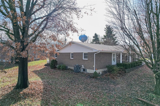 view of side of property with cooling unit