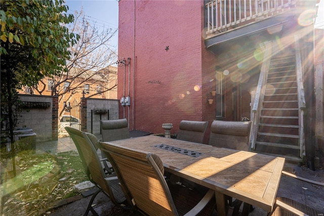 view of patio featuring a balcony