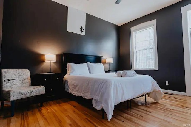 bedroom featuring light hardwood / wood-style flooring and ceiling fan