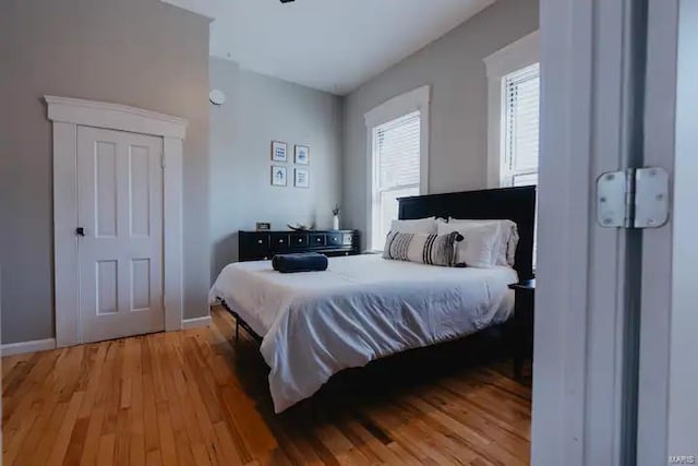 bedroom with hardwood / wood-style flooring