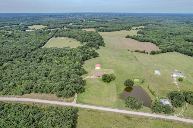 birds eye view of property with a rural view