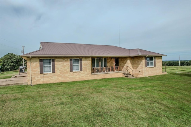 view of front of home with a front lawn and a porch