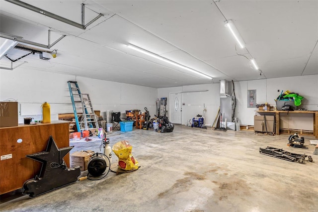 garage with electric panel and a garage door opener