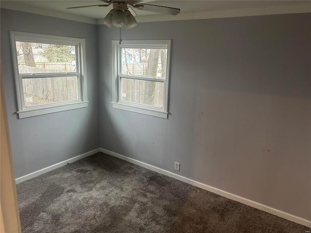 empty room with ceiling fan and carpet floors