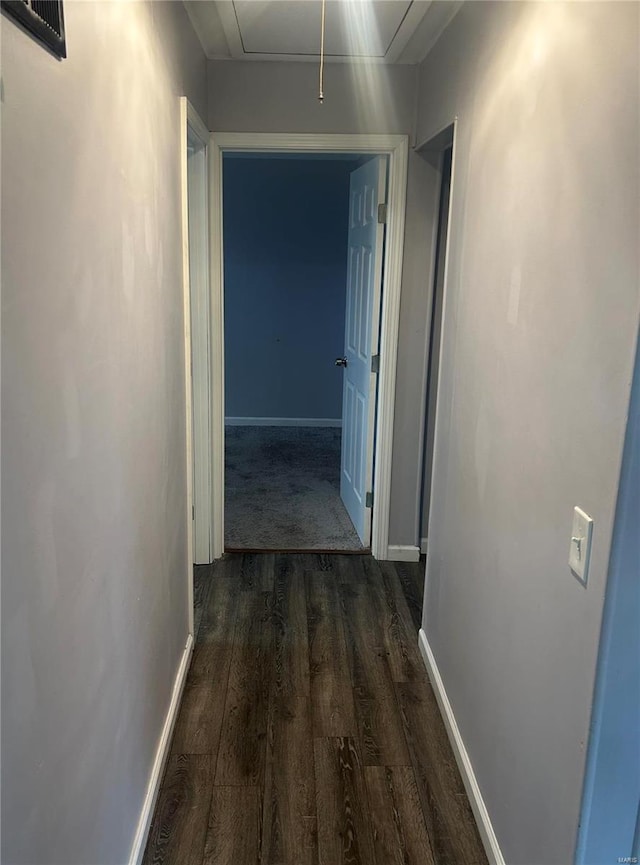 corridor featuring dark hardwood / wood-style floors