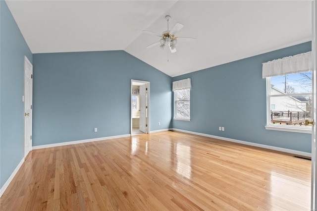 unfurnished bedroom with multiple windows, ceiling fan, lofted ceiling, and light wood-type flooring