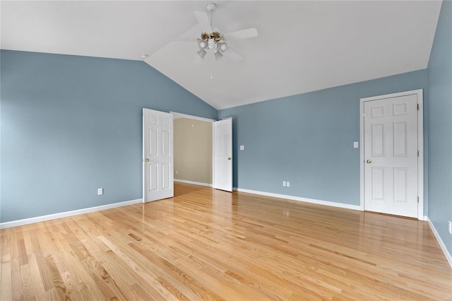 unfurnished bedroom featuring light hardwood / wood-style flooring, vaulted ceiling, and ceiling fan