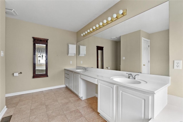 bathroom with tile patterned flooring and vanity