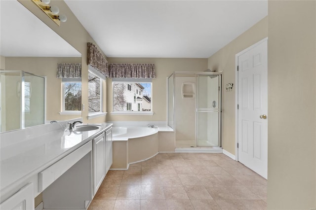 bathroom featuring vanity and independent shower and bath