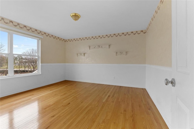 unfurnished room with wood-type flooring