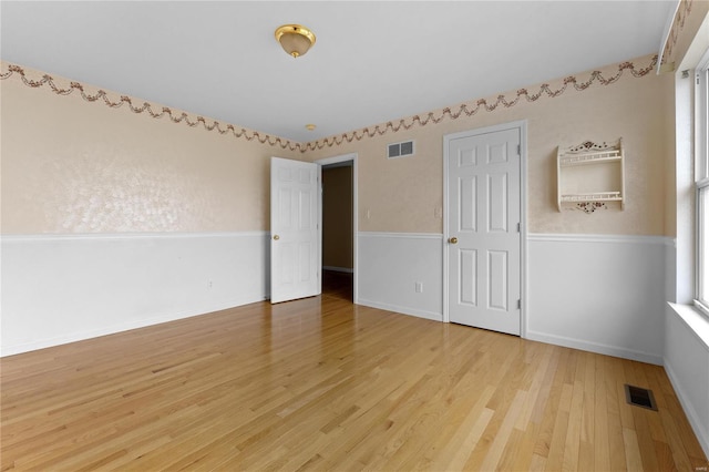 spare room featuring hardwood / wood-style floors