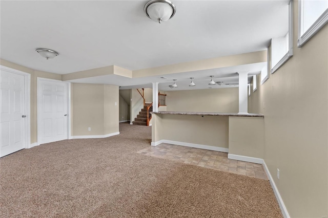 unfurnished living room featuring light carpet