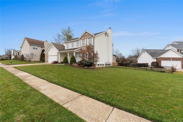 view of front facade with a garage and a front lawn