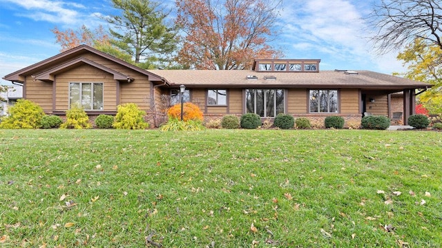 ranch-style house with a front yard