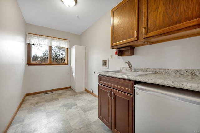 kitchen with white refrigerator and sink