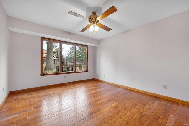 unfurnished room with ceiling fan and light hardwood / wood-style flooring