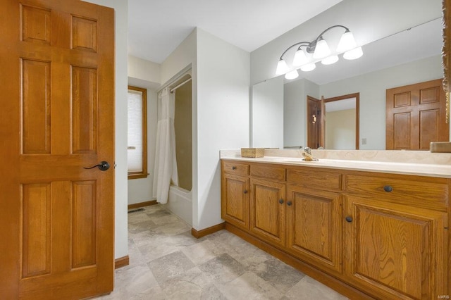 bathroom with vanity and shower / bath combination with curtain