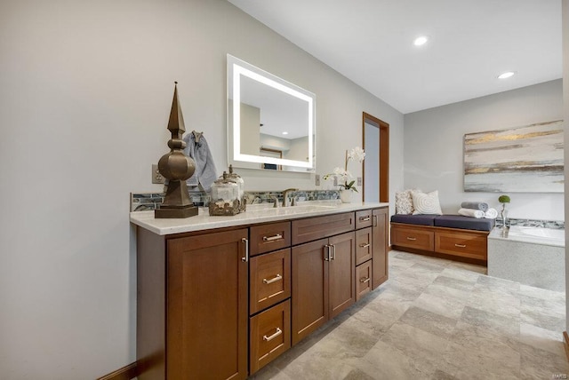 bathroom featuring a tub and vanity