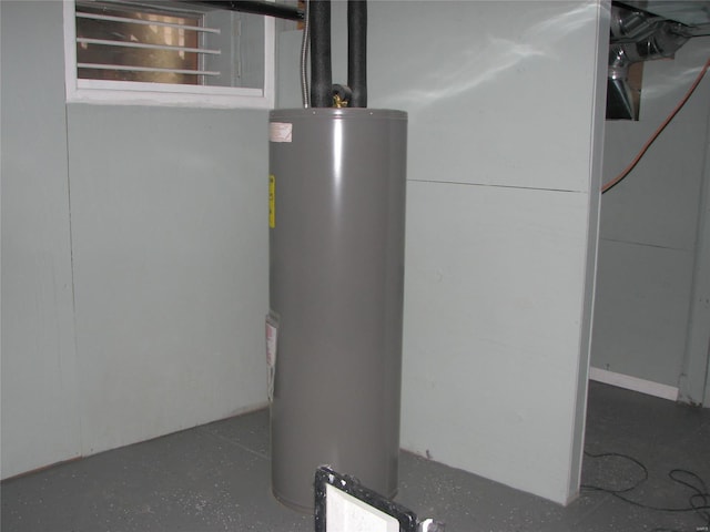 utility room featuring gas water heater