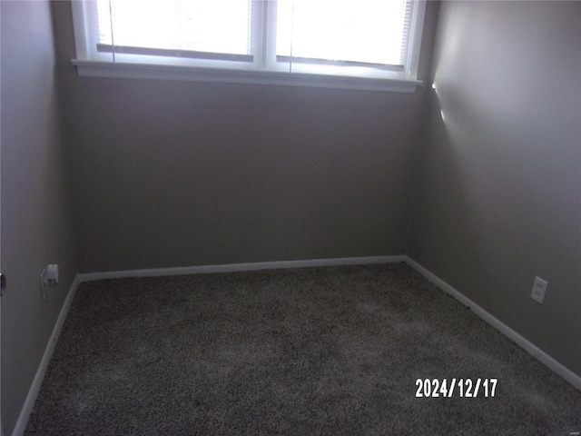 carpeted empty room with a wealth of natural light