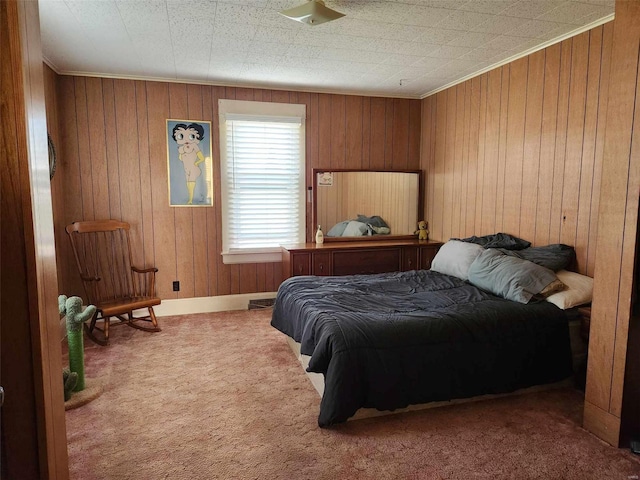 carpeted bedroom featuring wood walls