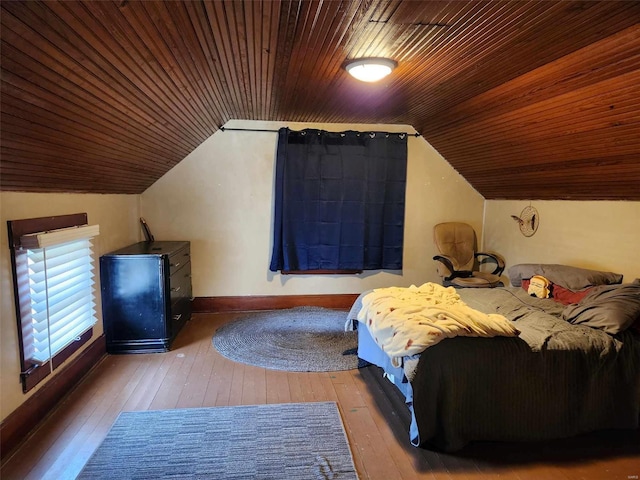 unfurnished bedroom with wood ceiling, wood-type flooring, and vaulted ceiling