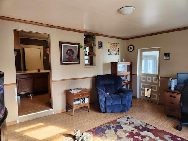 interior space with crown molding and light hardwood / wood-style flooring