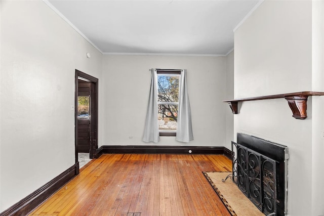 interior space featuring hardwood / wood-style flooring and ornamental molding