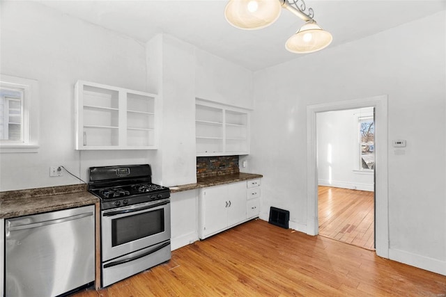 kitchen featuring white cabinetry, light hardwood / wood-style floors, and appliances with stainless steel finishes