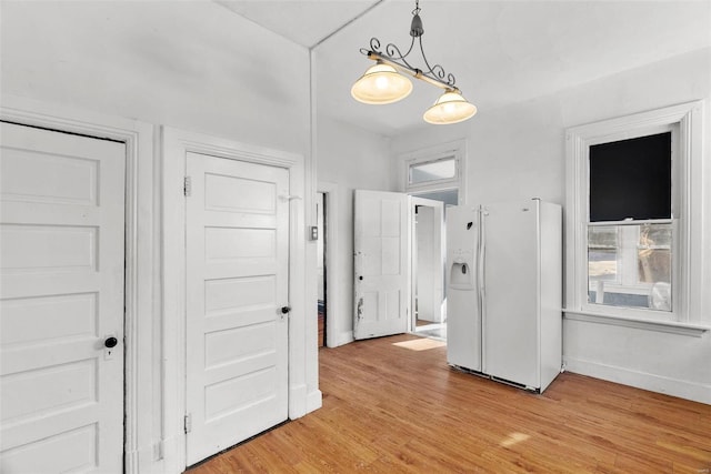 corridor featuring light hardwood / wood-style floors