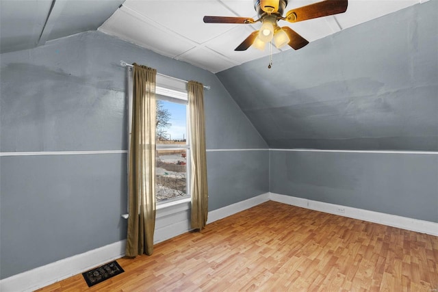 bonus room with lofted ceiling, ceiling fan, and light hardwood / wood-style flooring