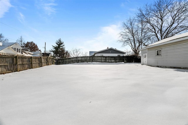 view of yard layered in snow