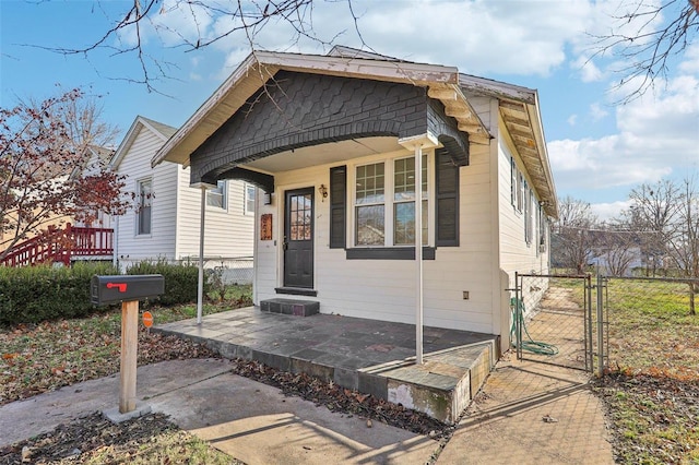 bungalow-style home featuring covered porch