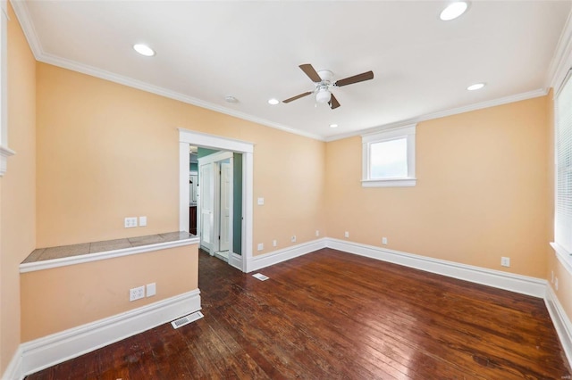 spare room featuring dark hardwood / wood-style floors, ceiling fan, and ornamental molding