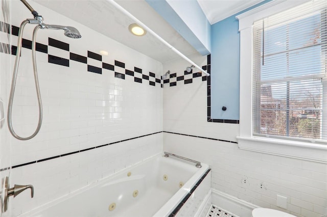 bathroom with tiled shower / bath, ornamental molding, and tile walls