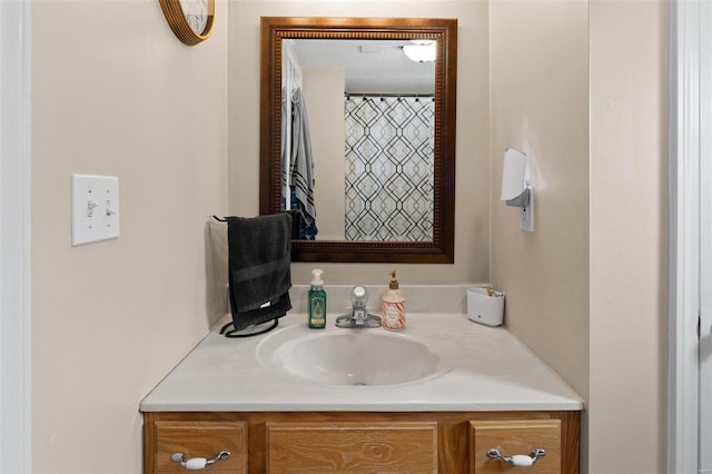 bathroom featuring vanity and a textured ceiling