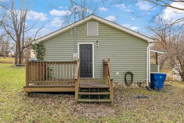 back of house featuring a deck