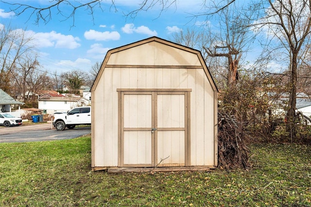 view of outbuilding featuring a yard