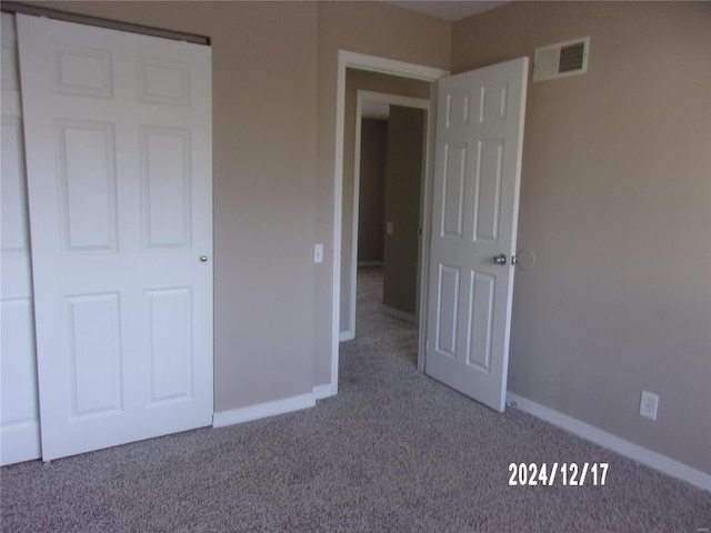 unfurnished bedroom with carpet floors