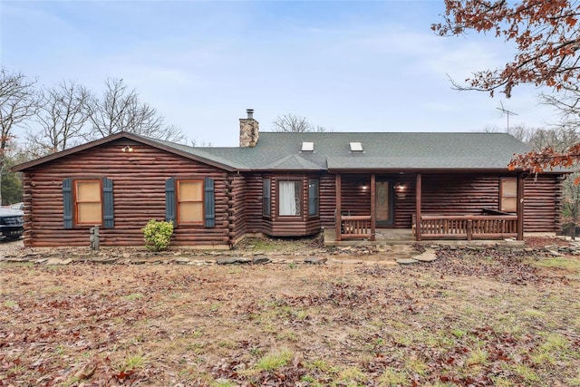 log-style house with a porch