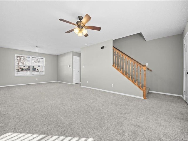 unfurnished living room featuring light carpet and ceiling fan