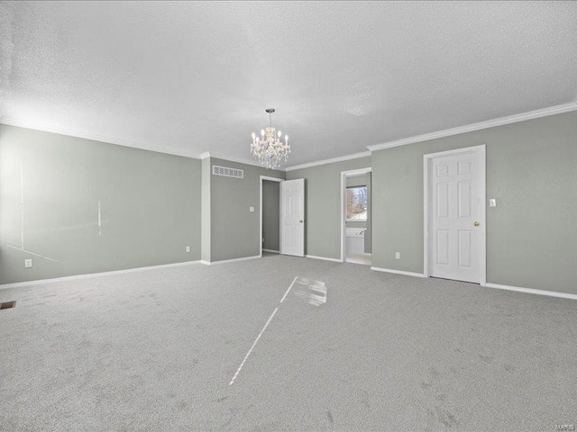 unfurnished bedroom with carpet, ornamental molding, and an inviting chandelier