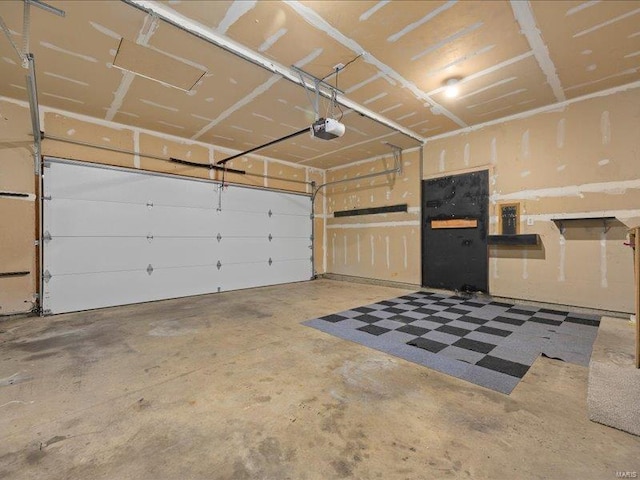 garage featuring a garage door opener