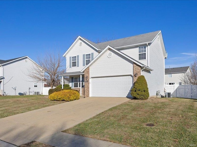 front of property featuring a garage, a front lawn, and cooling unit