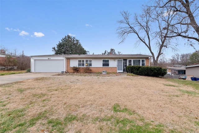 ranch-style house with a garage and a front yard